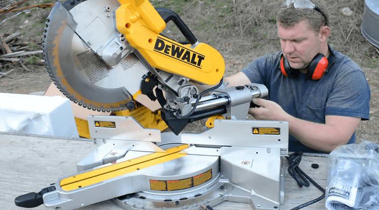 A man is setting up DEWALT DWS780 with ease