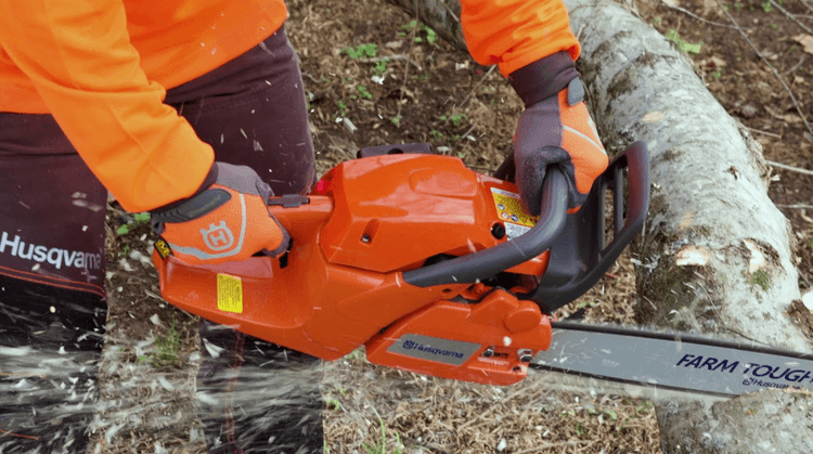 The Husqvarna 460 Rancher easily cuts through thick hardwood